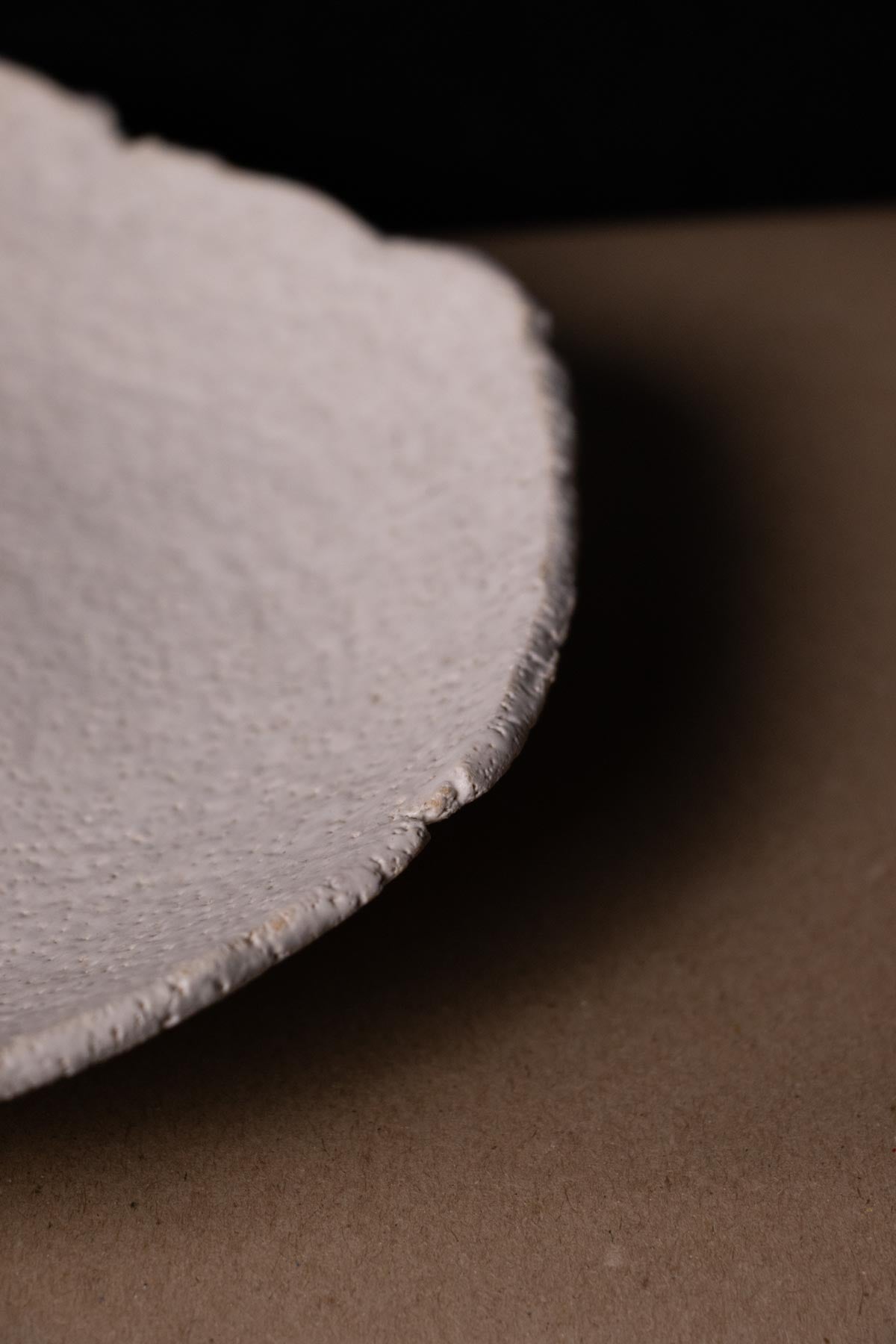 Close-up of a white ceramic ritual dish.