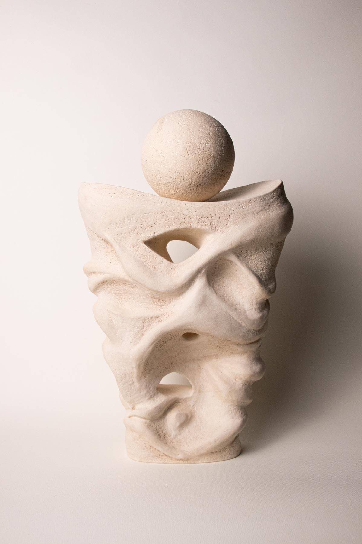 Abstract contemporary ceramic sculpture. Off-white, cream colour. White stoneware. Handmade ceramic sculpture. Handmade Italian ceramics.