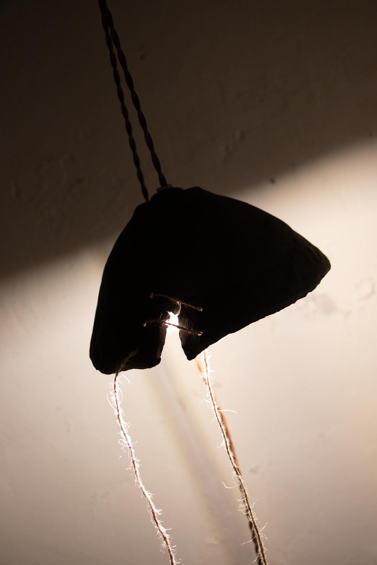 Moody atmosphere with ceramic pendant lamp.