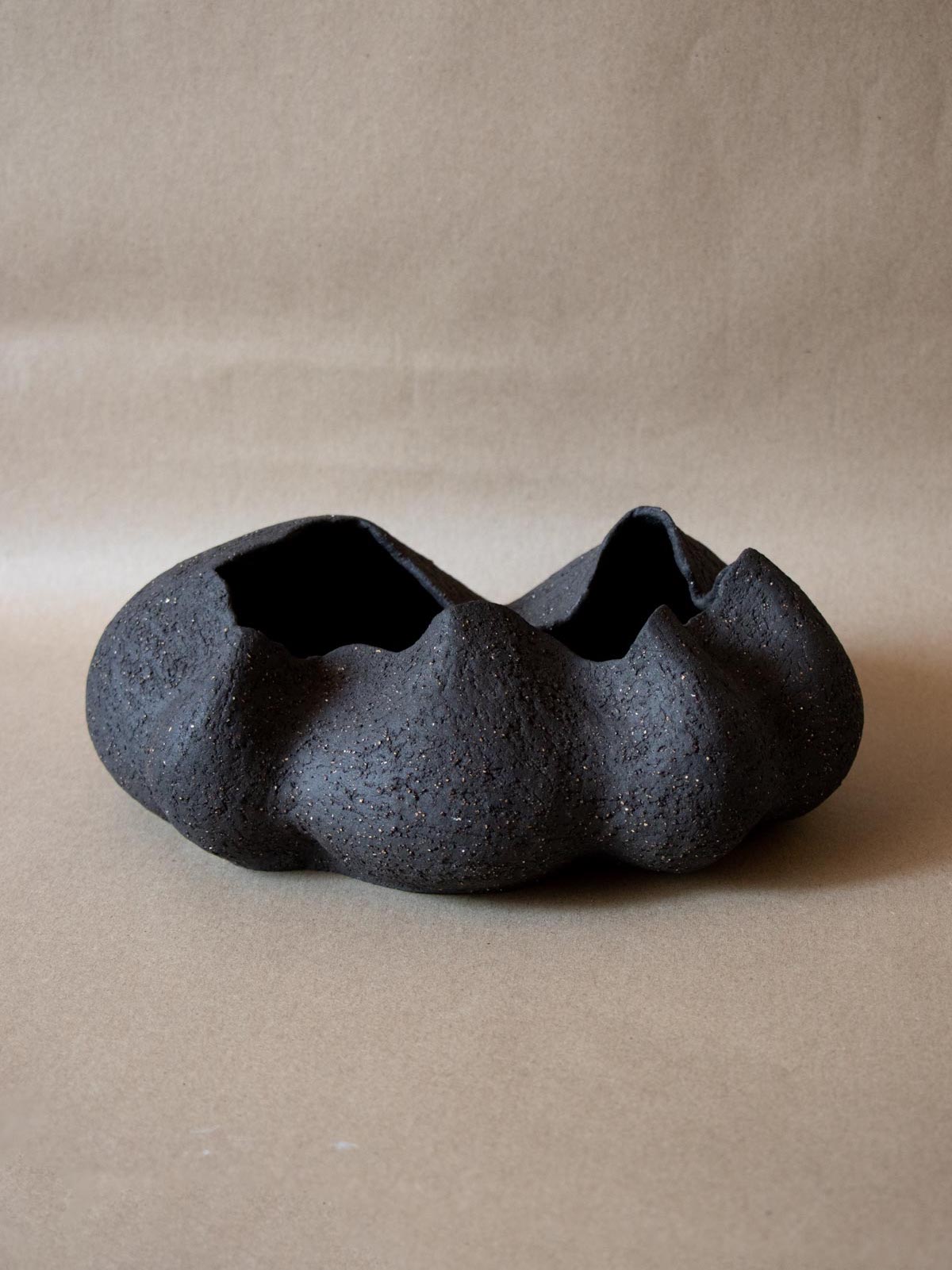 Contemporary black ceramic sculpture. Abstract shape. Table and shelf decor. Functional art. Made in Italy.