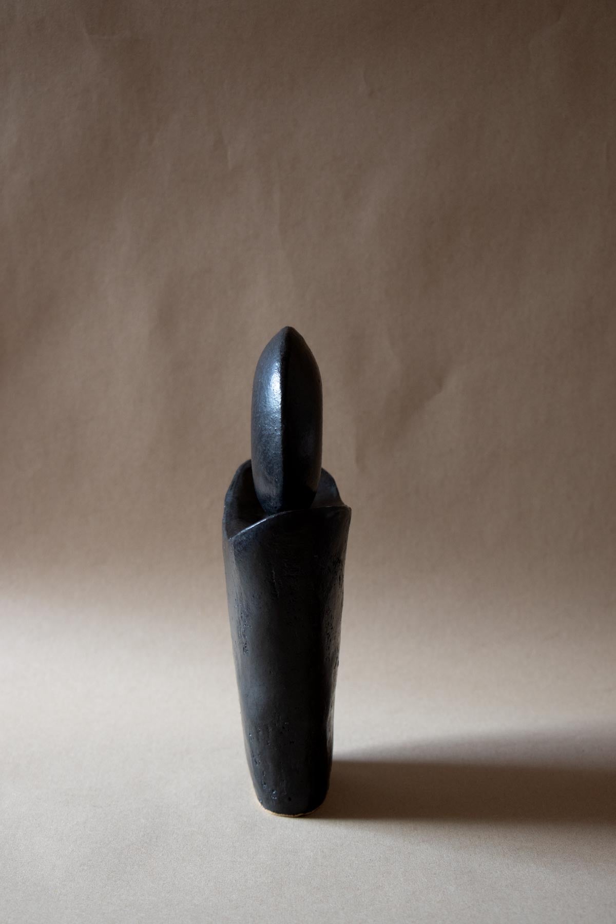 Black ceramic sculpture inspired by the New Moon. New Moon sculpture. Yoga studio decor. Meditation room decor. handmade ceramics by Claire Lune.