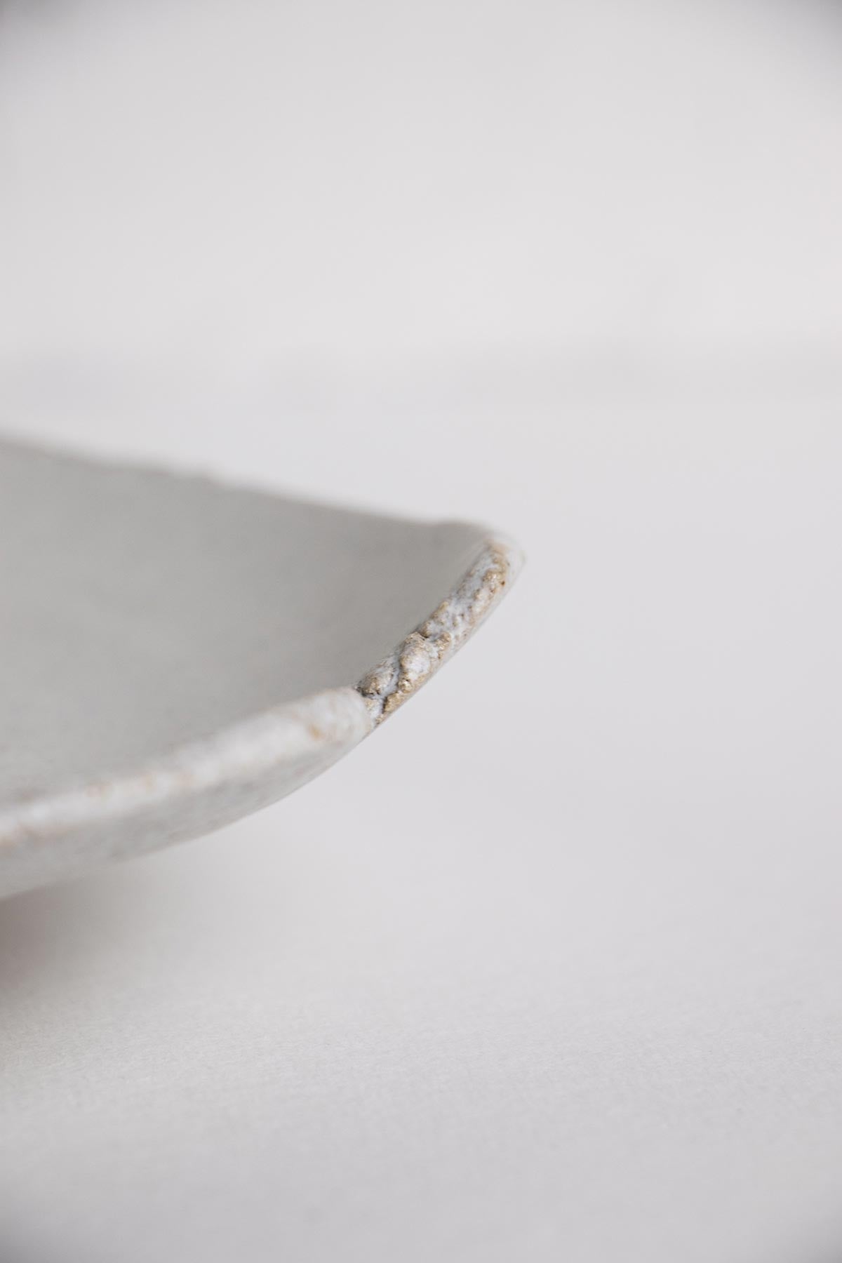 Detail of white ceramic decorative dish. Smudge dish. Artistic ceramics. Artistic dish. Ceramic home decor by Claire Lune.