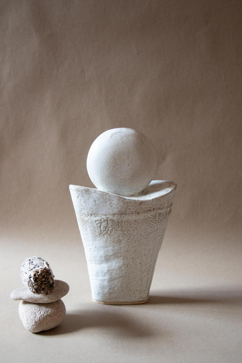White ceramic sculpture inspired by the Full Moon. Contemporary ceramic sculpture. Yoga studio decor. Full Moon. Handmade ceramics made in Italy. Claire Lune.