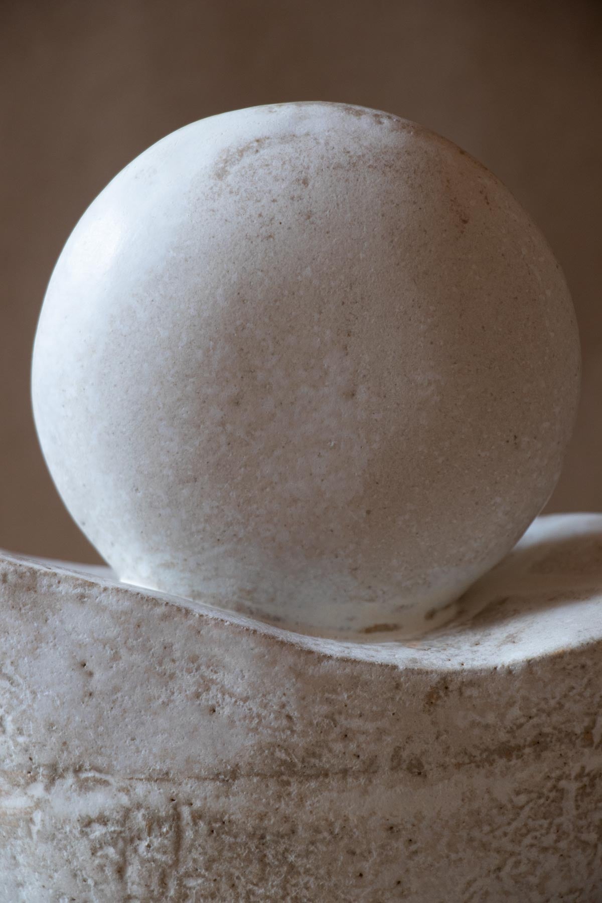 White ceramic sculpture inspired by the Full Moon. Contemporary ceramic sculpture. Yoga studio decor. Full Moon. Handmade ceramics made in Italy. Claire Lune.