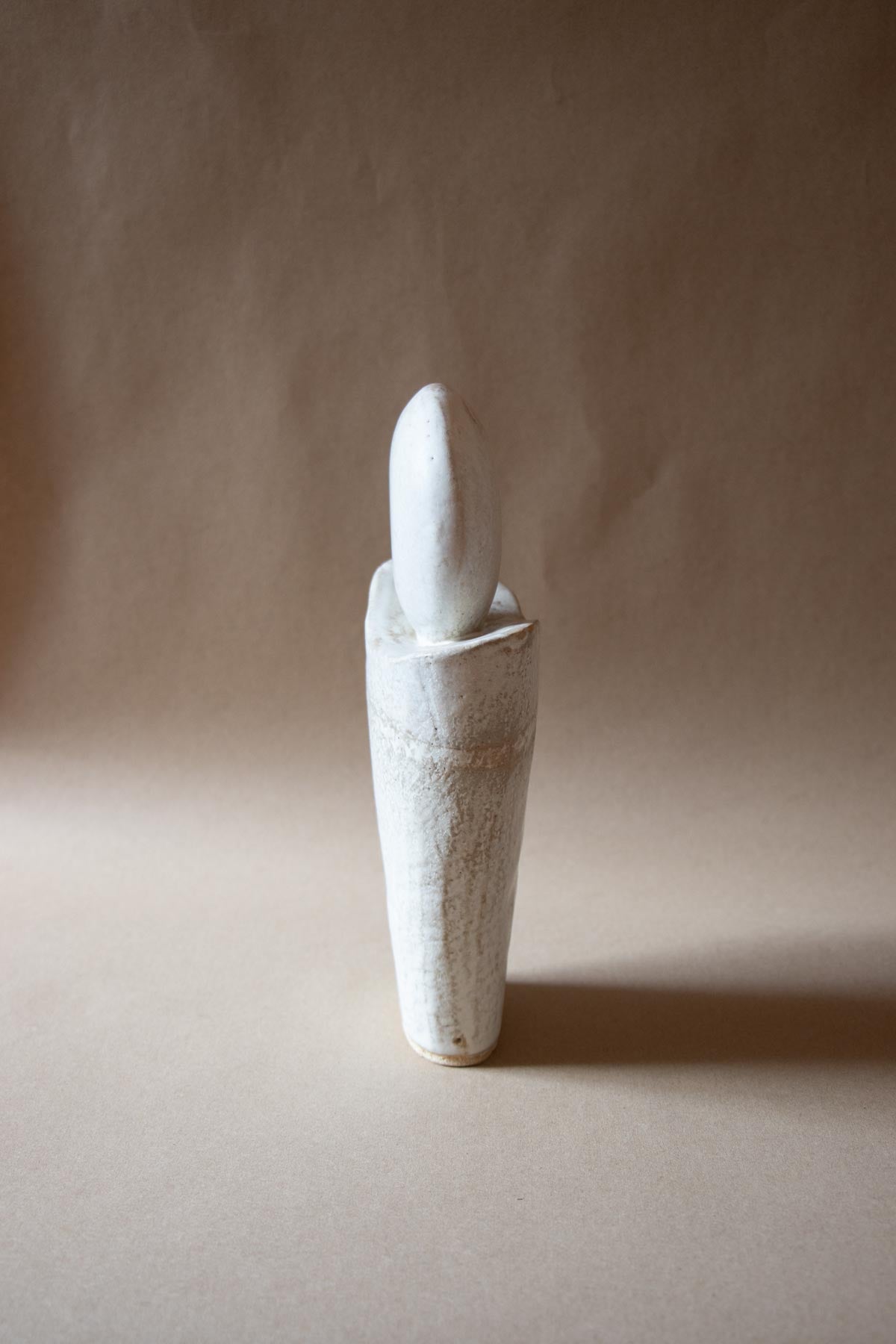 White ceramic sculpture inspired by the Full Moon. Contemporary ceramic sculpture. Yoga studio decor. Full Moon. Handmade ceramics made in Italy. Claire Lune.