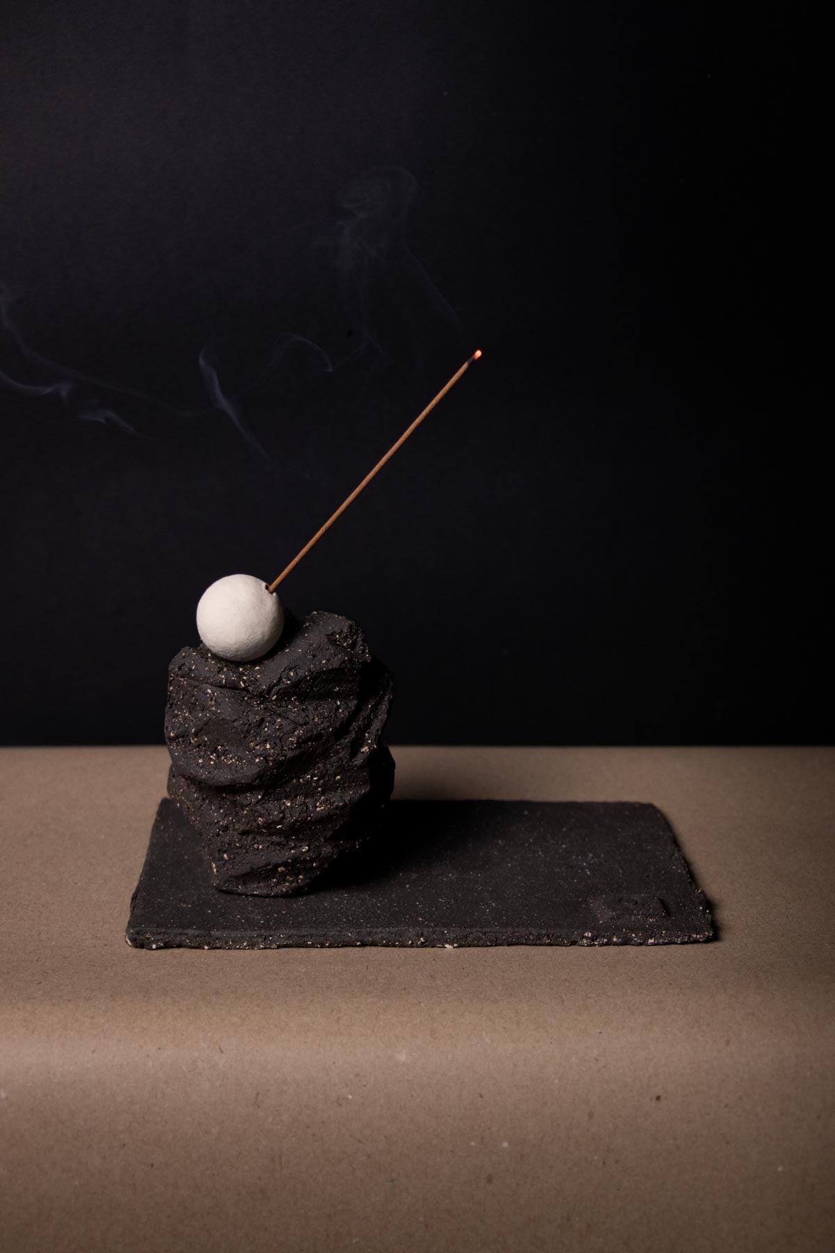 Incense burning from a ceramic incense holder by Claire Lune. Incense smoke. Incense holder. Ceramic incense holder. Design incense burner. 
