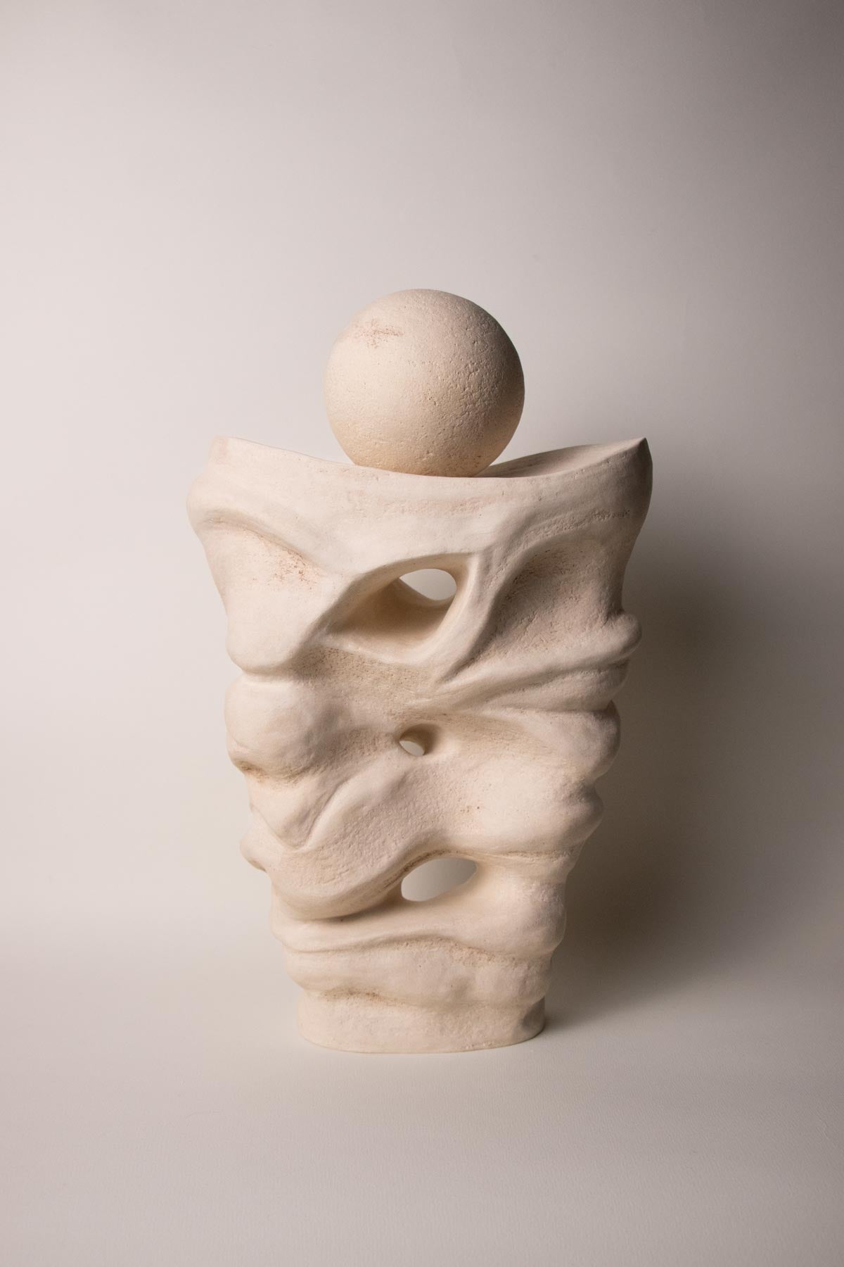 Abstract contemporary ceramic sculpture. Off-white, cream colour. White stoneware. Handmade ceramic sculpture. Handmade Italian ceramics. 