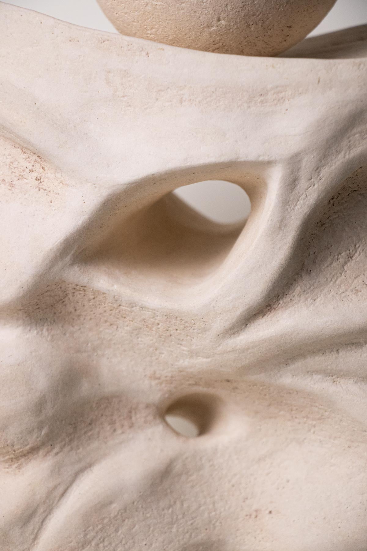 Close-up of sculpture. Textured surface. Ceramic sculpture. Stoneware sculpture. 