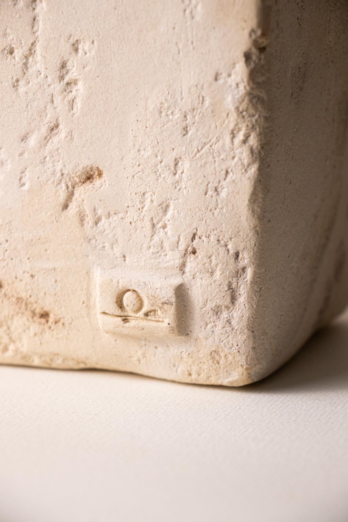 Close-up of Claire Lune logo and surface texture. Ceramic sculpture. Stoneware ceramics. Handmade ceramic sculpture. Contemporary decor. Minimalist design. Slow design. Intuitive design. Italian handmade ceramics.