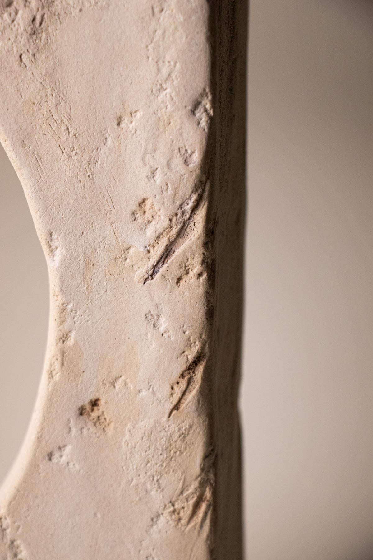 Close-up of ceramic surface. Organic texture. Organic surface. Off-white stoneware. 