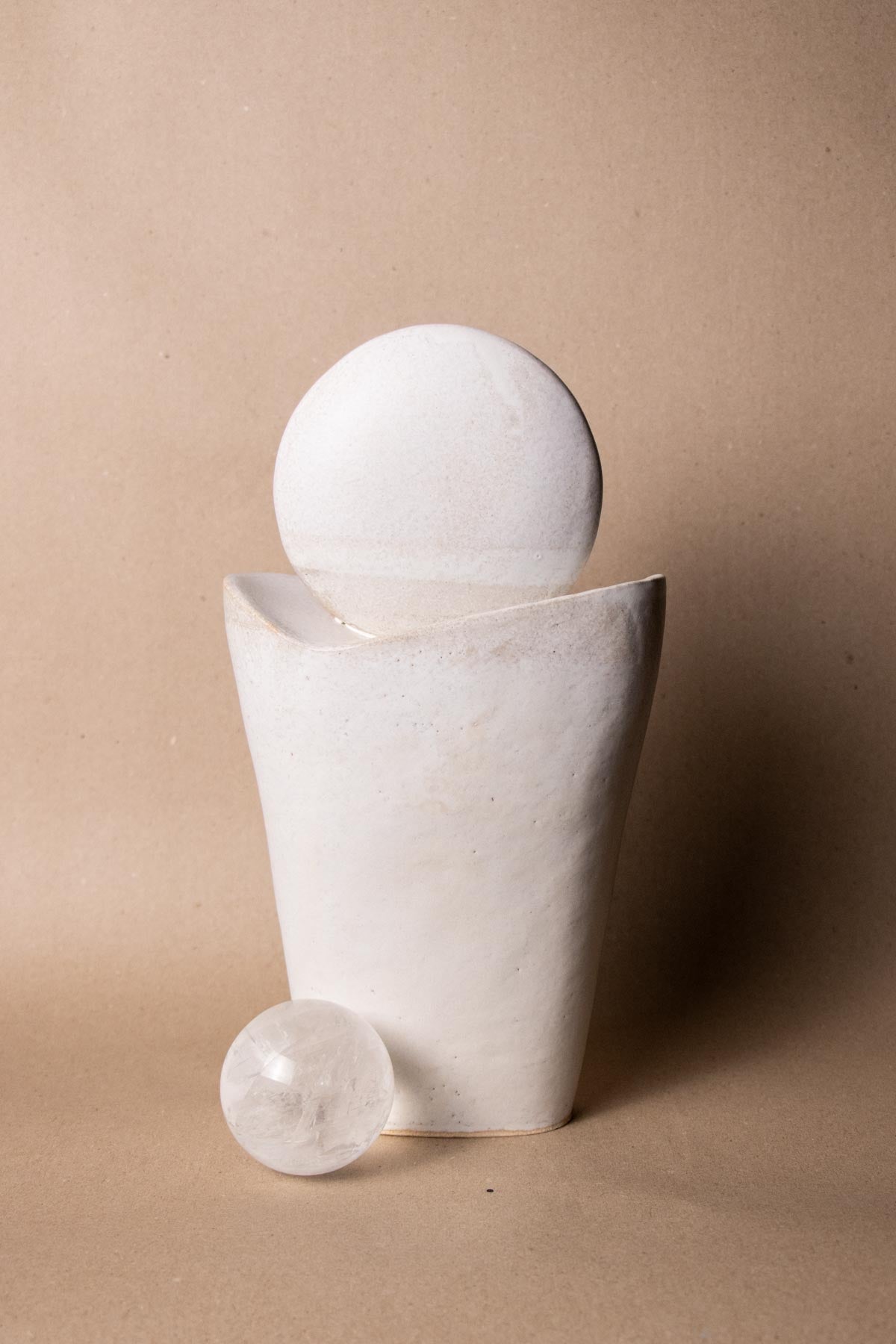White ceramic sculpture inspired by the Full Moon. Contemporary ceramic sculpture. Yoga studio decor. Full Moon. Handmade ceramics made in Italy. Claire Lune.