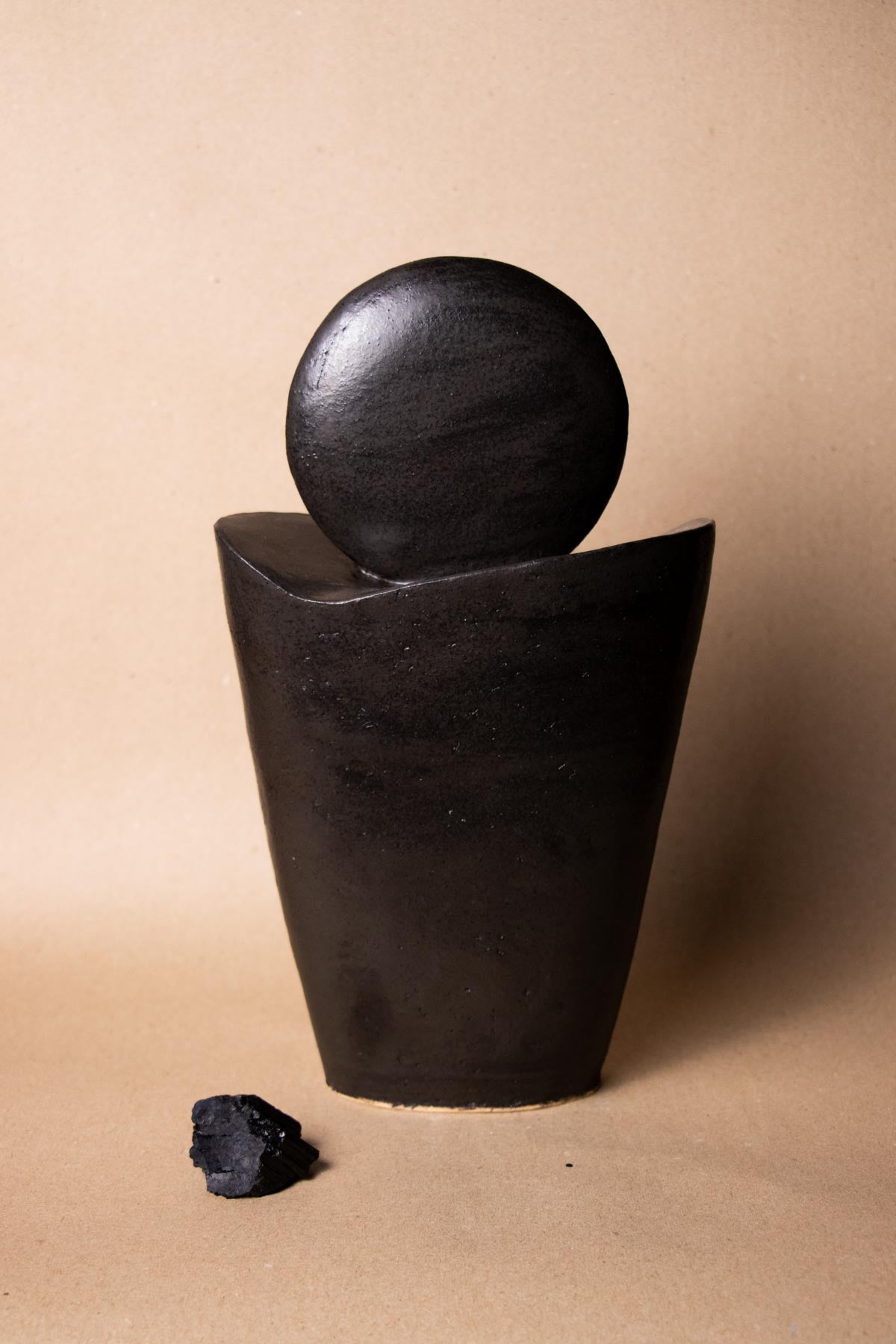 Black ceramic sculpture inspired by the New Moon. New Moon sculpture. Yoga studio decor. Meditation room decor. handmade ceramics by Claire Lune. Stoneware ceramics. Stoneware sculpture. Black sculpture. Handmade in Italy