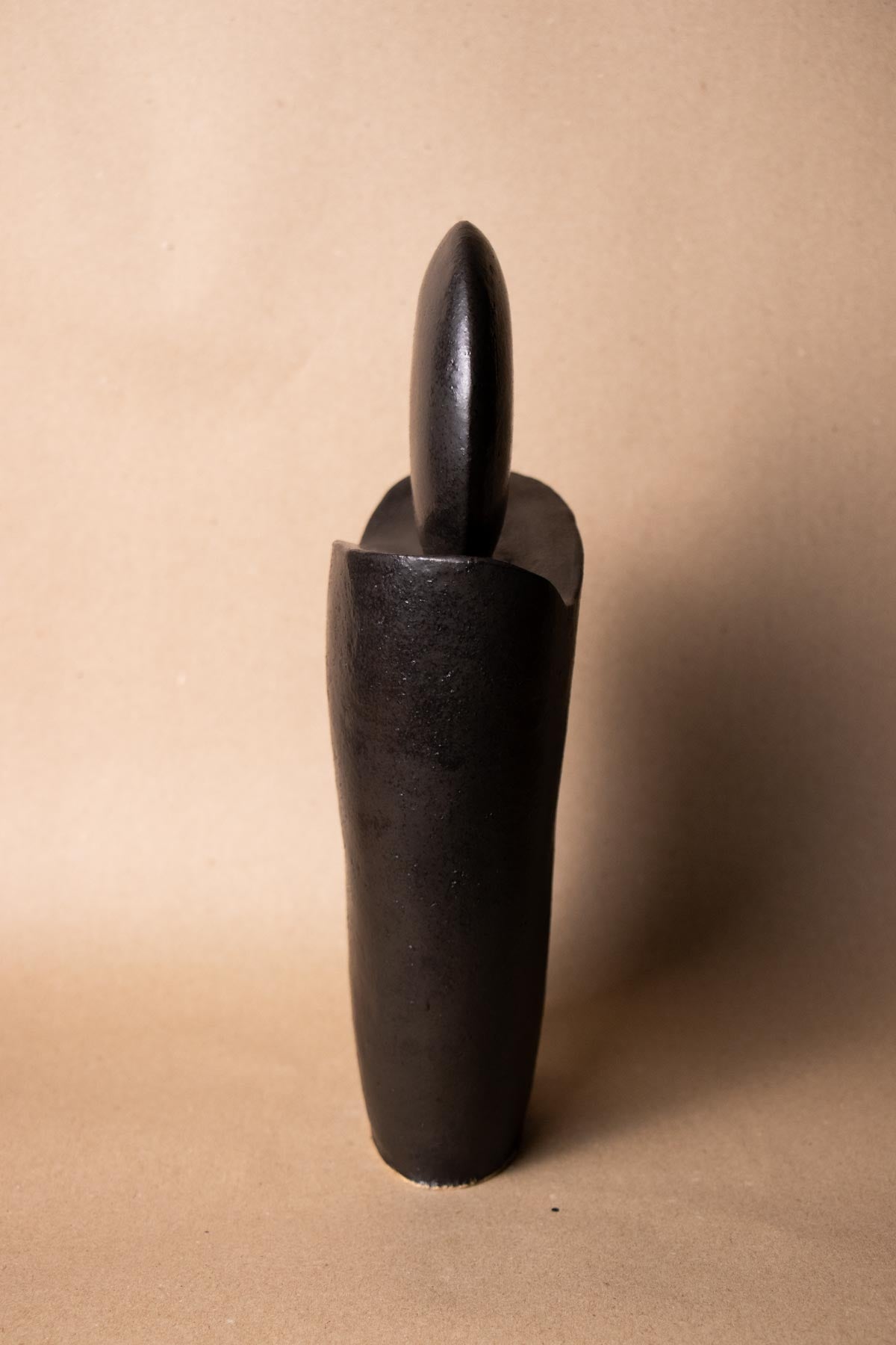Side view of Black ceramic sculpture. Handmade ceramics. Black ceramics. Stoneware ceramics. Contemporary ceramics. Contemporary sculpture. Minimalist decor pieces.New moon. Claire Lune. Handmade Italian ceramics