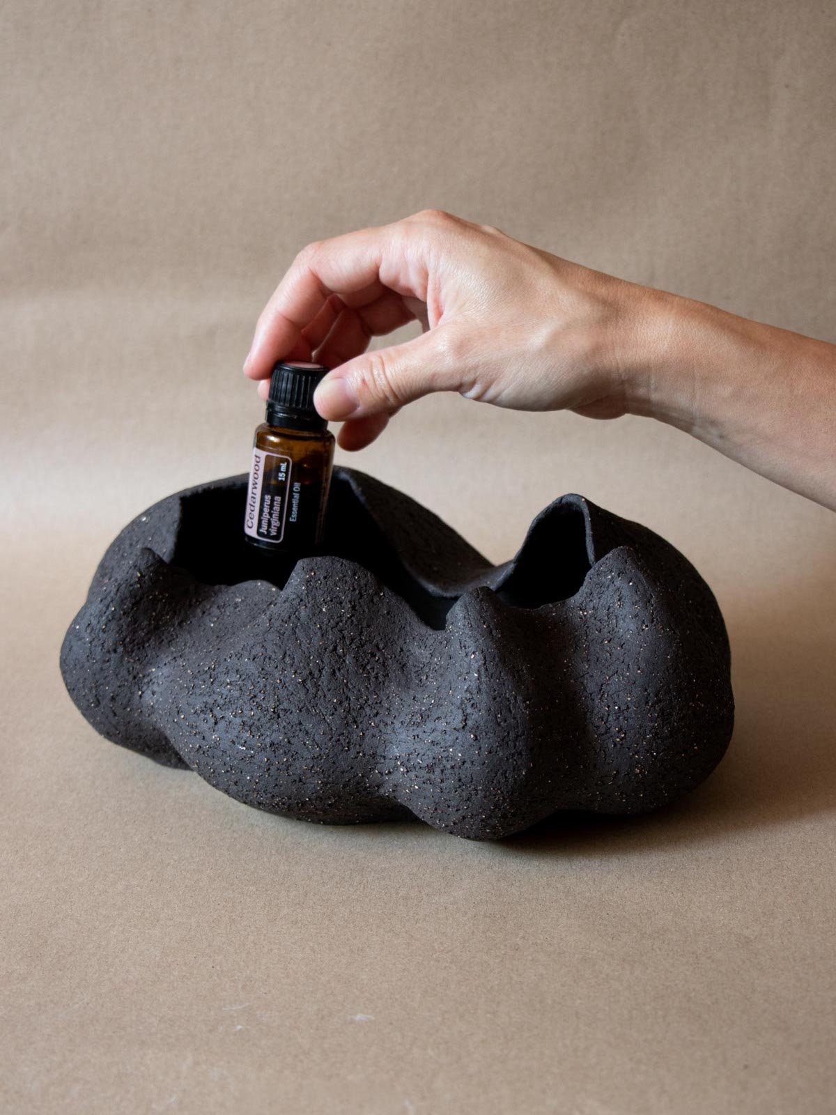 Contemporary black ceramic sculpture. Abstract shape. Table and shelf decor. Functional art. Essential oils holder. Doterra essential oils.Made in Italy. 