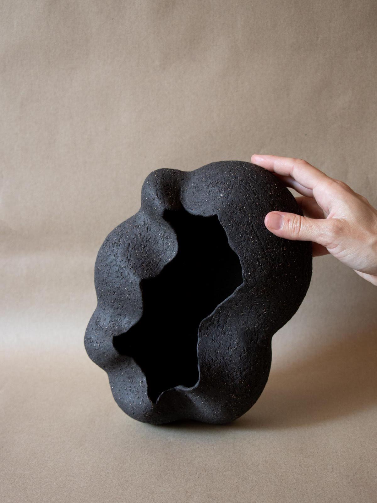 Contemporary black ceramic sculpture. Abstract shape. Table and shelf decor. Functional art. Made in Italy. 