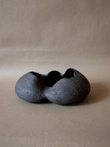 Contemporary black ceramic sculpture. Abstract shape. Table and shelf decor.