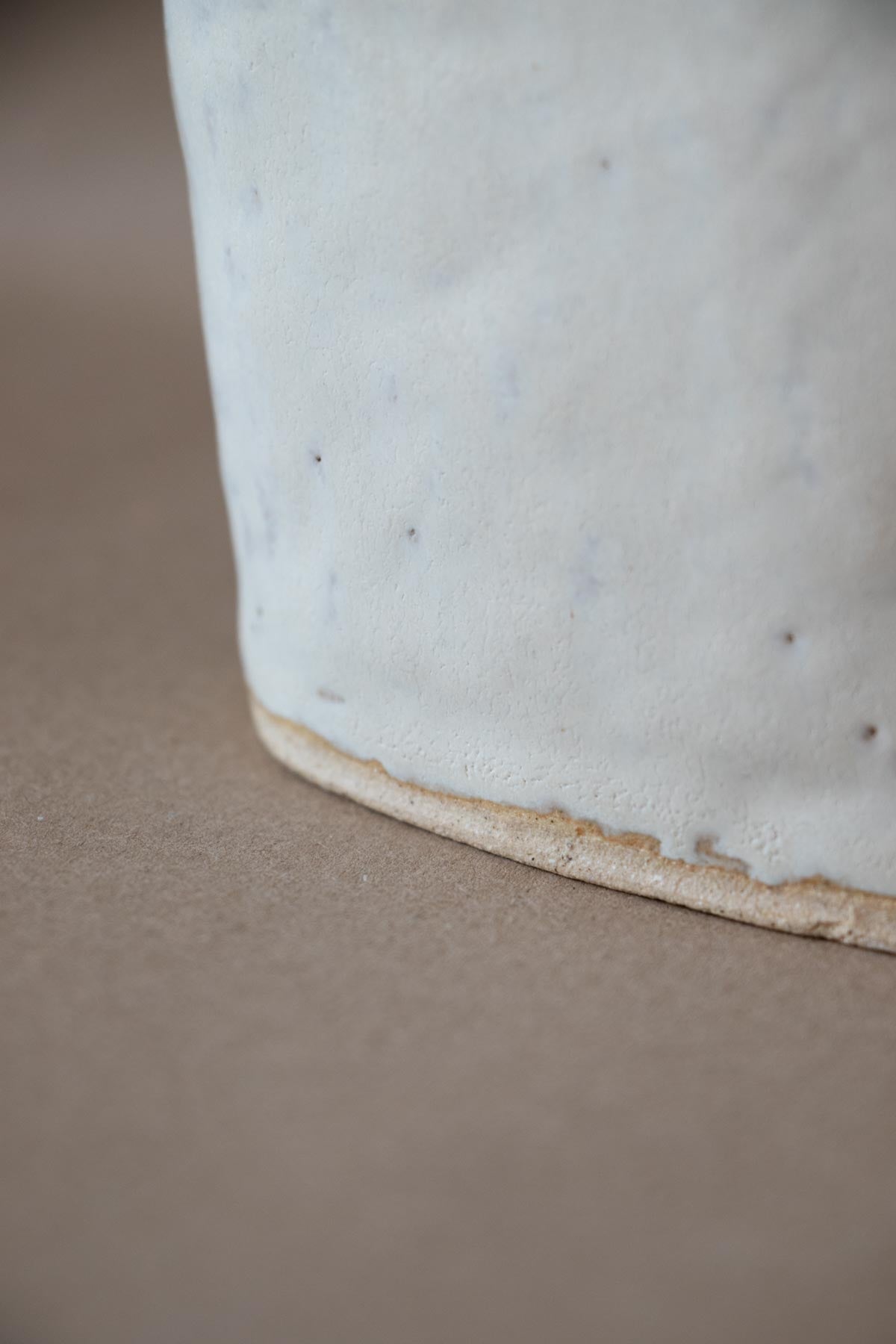 detail of White contemporary ceramic sculpture. Handmade ceramic sculpture. Moon. Luna Nuova I. Claire Lune sculpture by Chiara Della Santina.