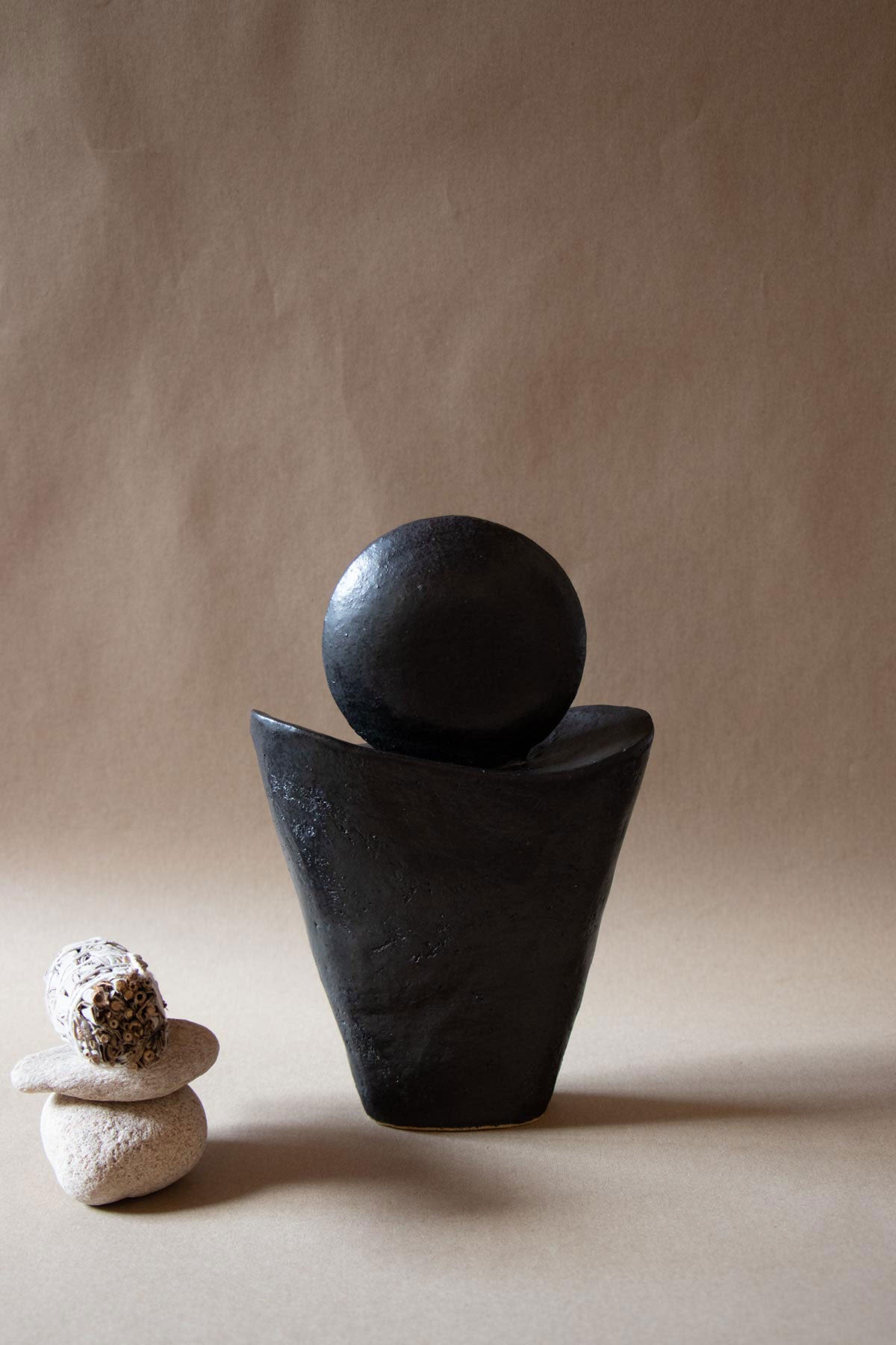 Black ceramic sculpture inspired by the New Moon. New Moon sculpture. Yoga studio decor. Meditation room decor. handmade ceramics by Claire Lune.