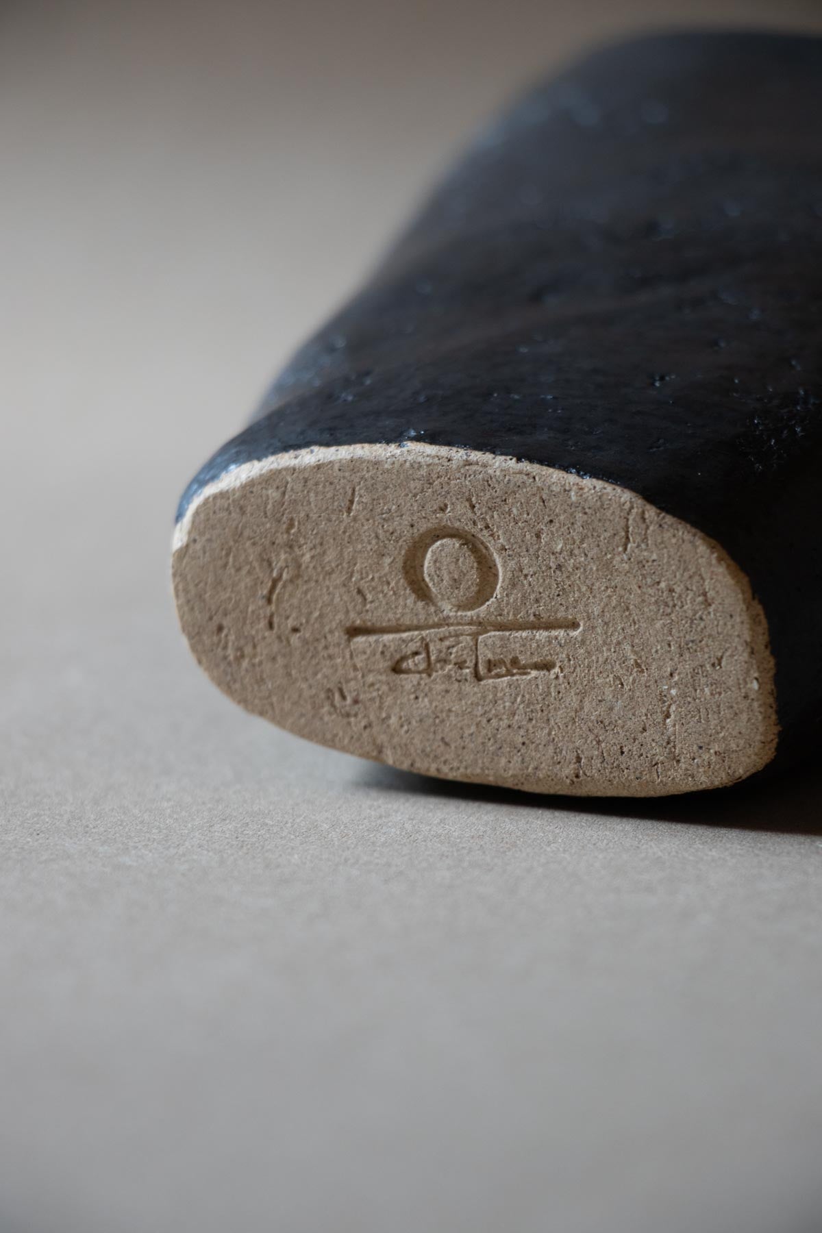 Black ceramic sculpture inspired by the New Moon. New Moon sculpture. Yoga studio decor. Meditation room decor. handmade ceramics by Claire Lune.