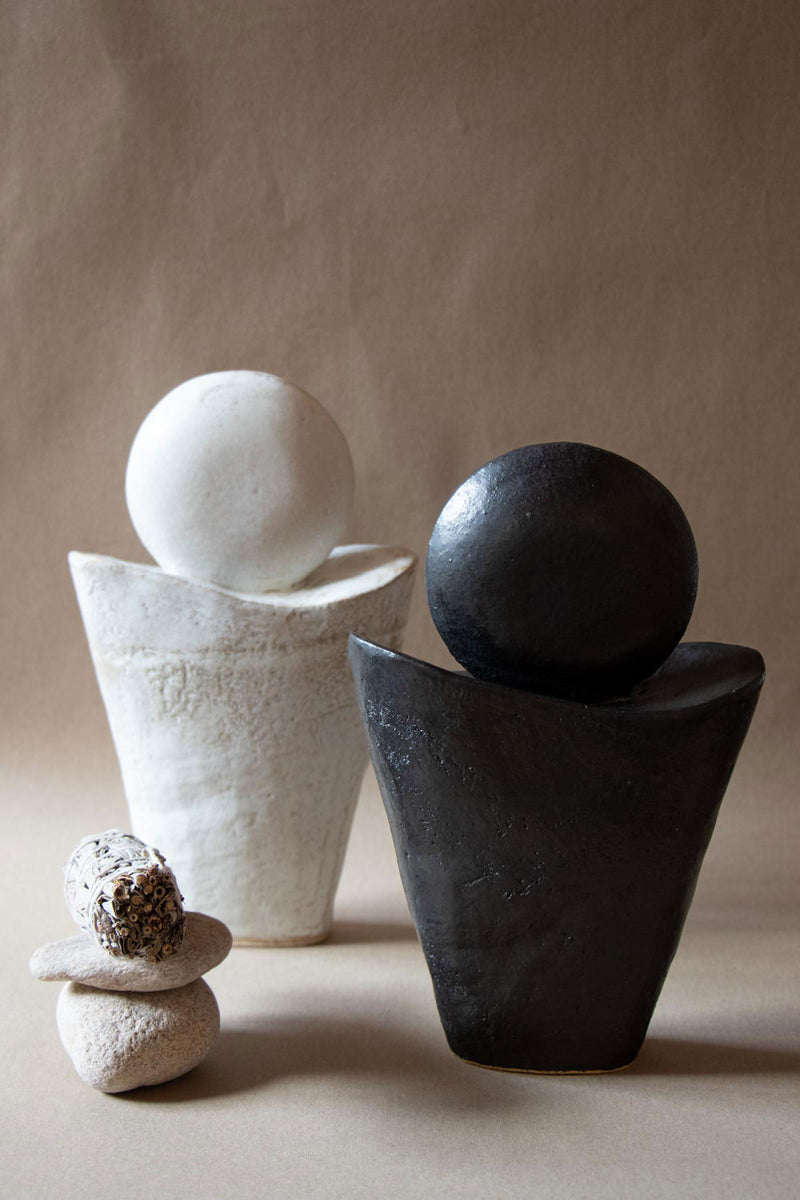 Black and white ceramic sculptures inspired by the New and Full  Moon. New Moon sculpture. Yoga studio decor. Meditation room decor. handmade ceramics by Claire Lune.