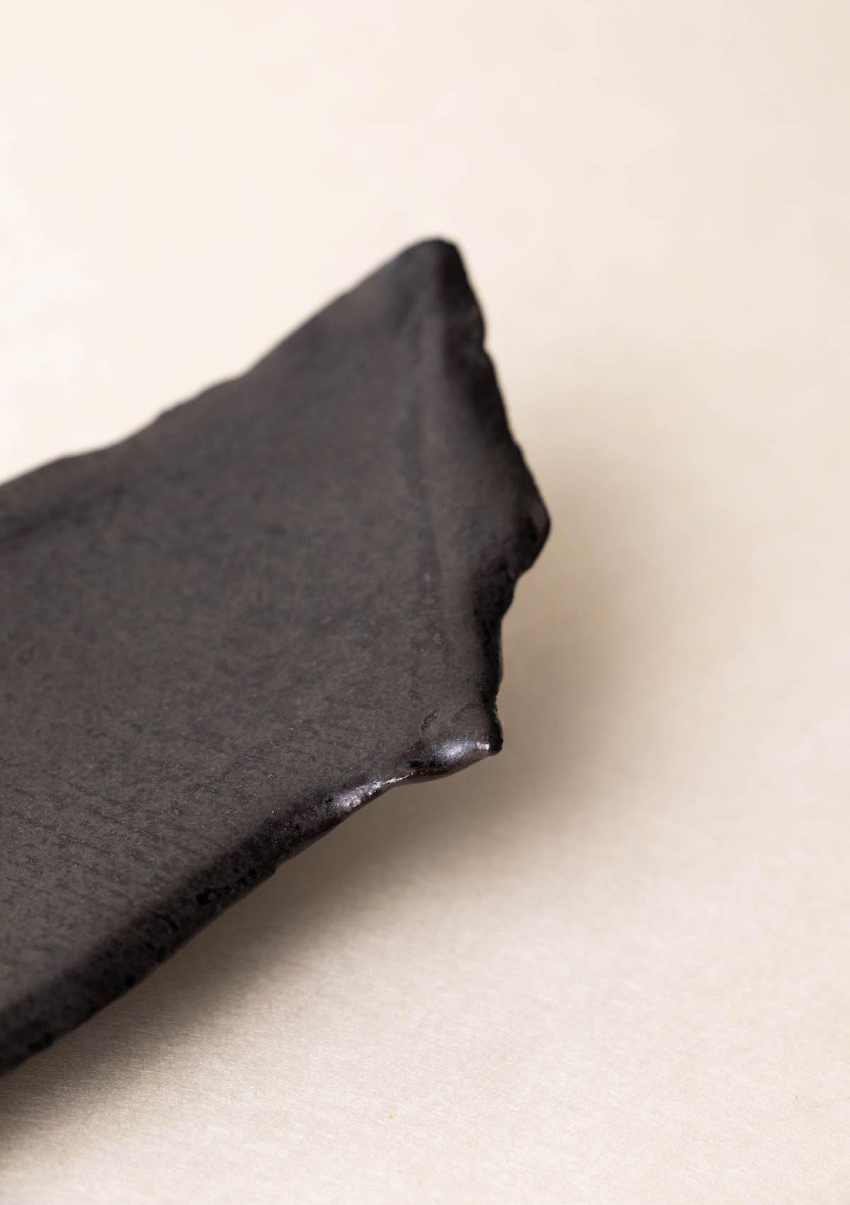 Luxury incense burner. Black incense burner. Handmade ceramic incense burner by Claire Lune. Styled on issue of Ark Journal. Surface and texture detail.