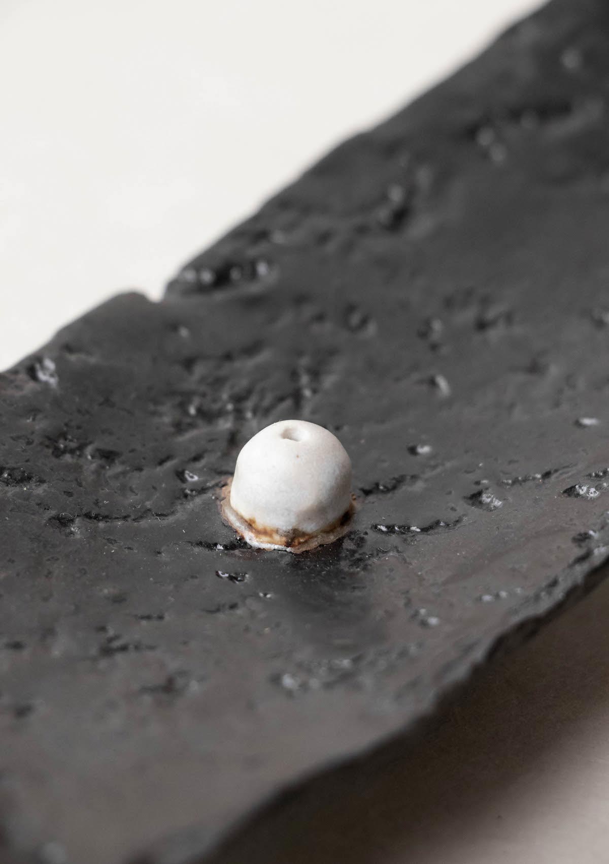 Luxury incense burner. Black incense burner with texture. Handmade ceramic incense burner by Claire Lune. Detail of textured surface.