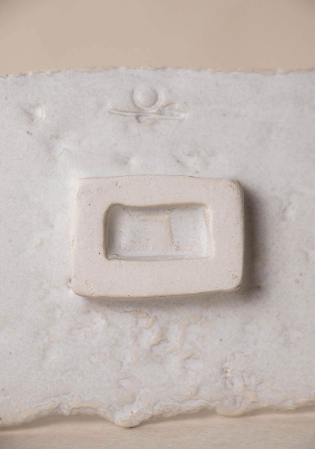 Luxury incense burner. White ceramic incense burner. Artistic incense burner. Detail of the foot.