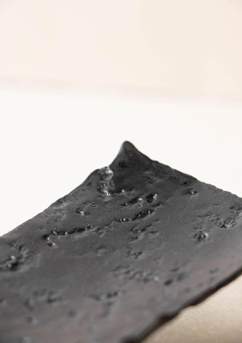 Luxury incense burner. Black incense burner with texture. Handmade ceramic incense burner by Claire Lune. Detail of textured surface.